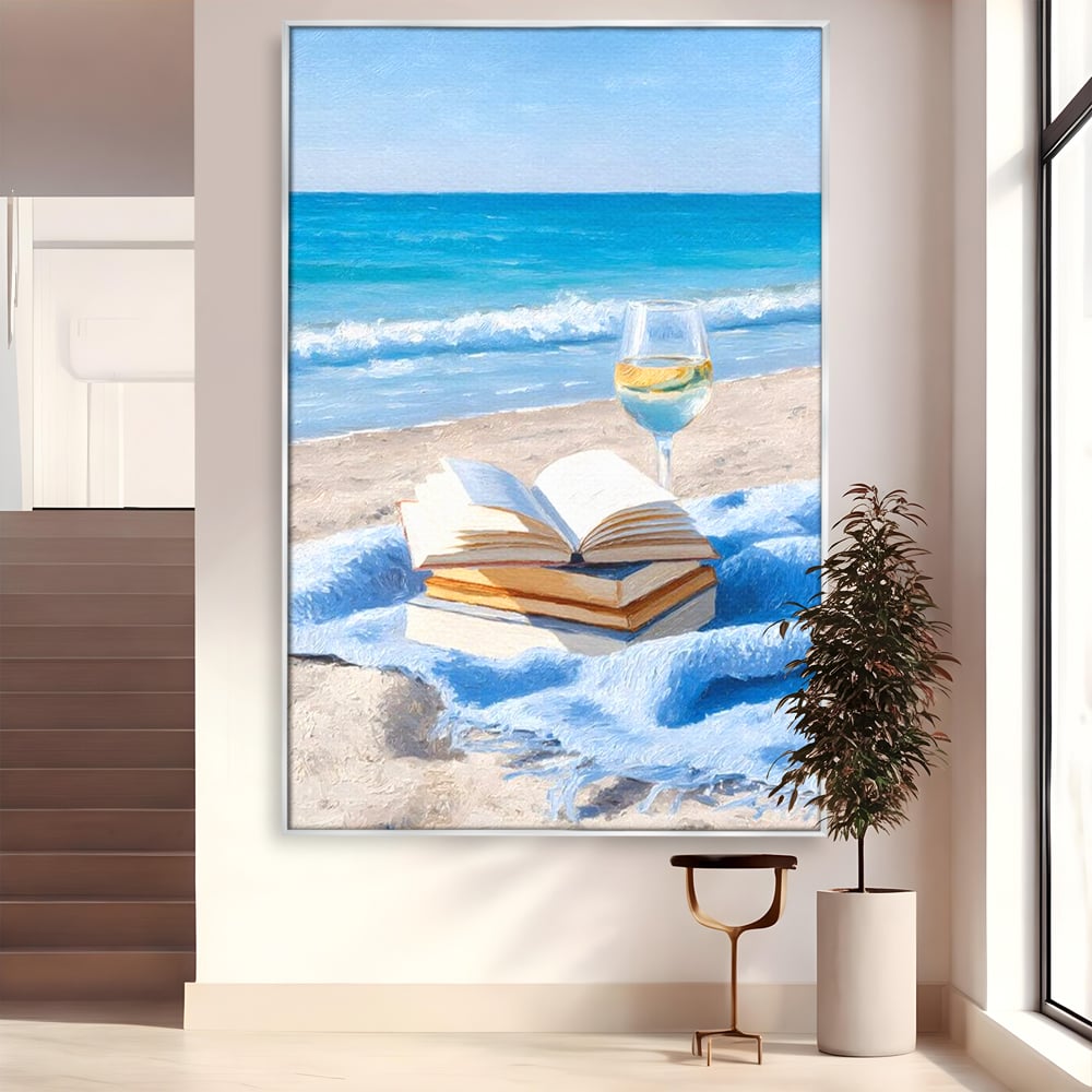 Tablou canvas cu pictura cu carti si pahar de vin pe plaja, in rama de aluminiu argintiu